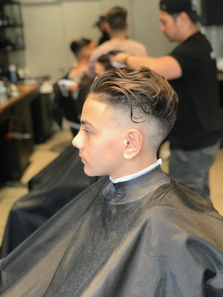 High fade with styled top
